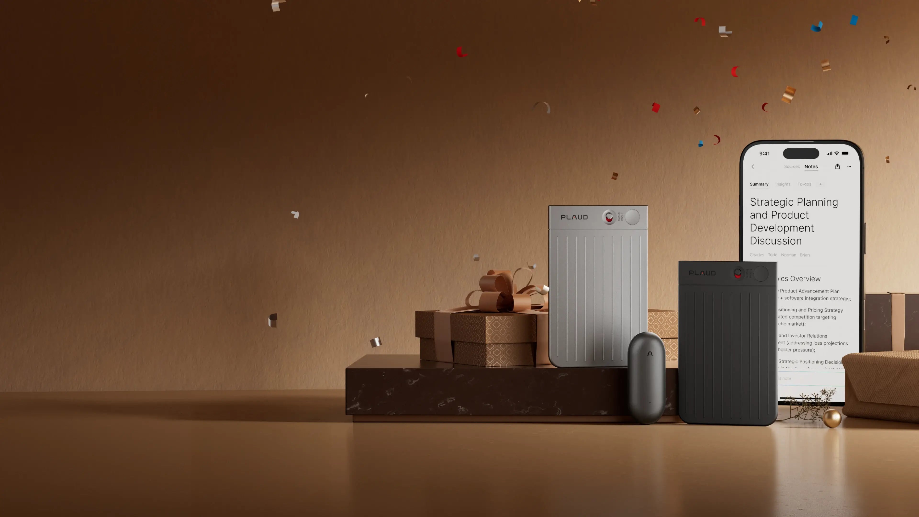 Silver and black Plaud Notes, dark gray Plaud NotePin, and smartphone showing Plaud App, with gifts and confetti.