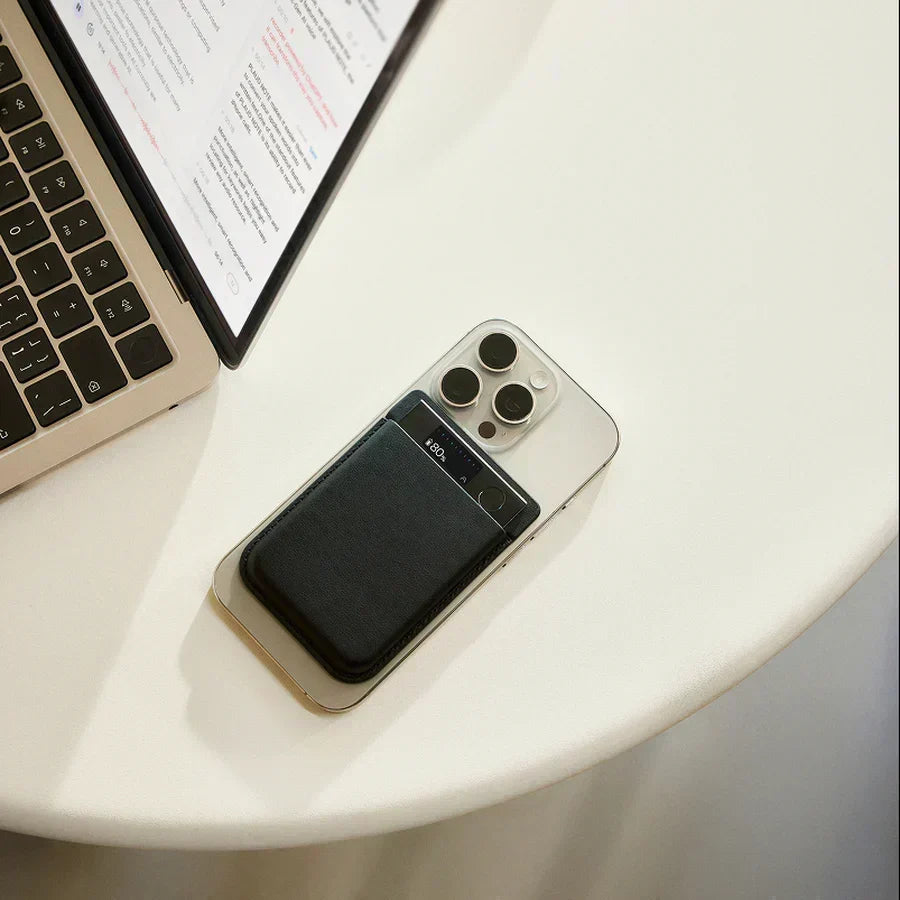 Smartphone and laptop on a round table