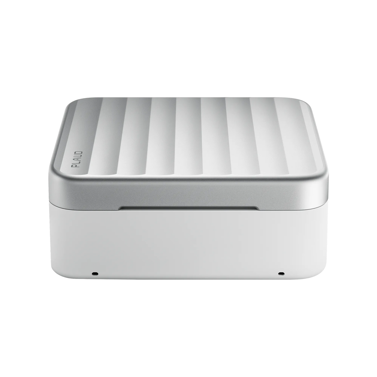 The Plaud One charging case features a white base and a silver lid with vertical ridges and the Plaud logo.