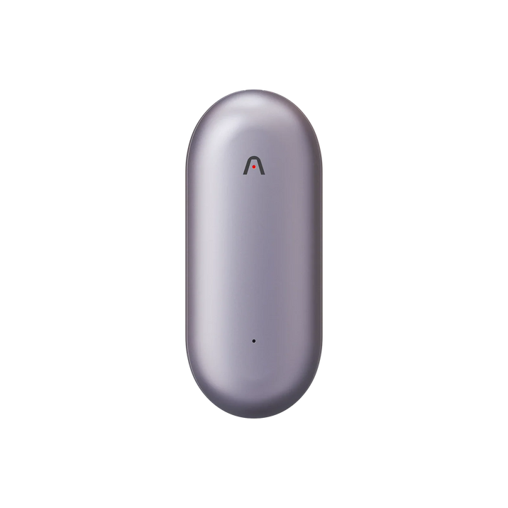 A metallic lavender Plaud NotePin, a capsule-shaped AI voice recorder, stands upright on a white background.